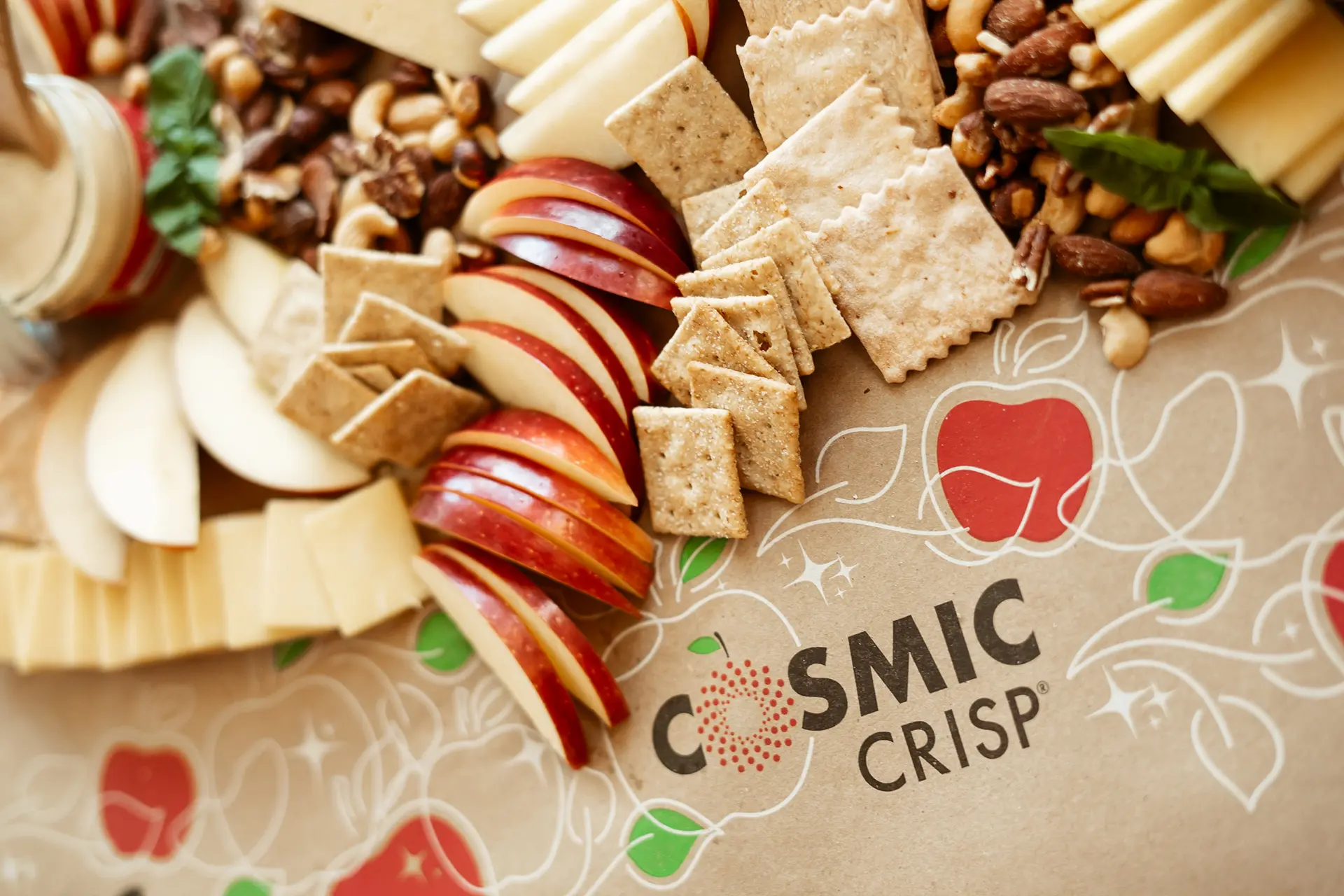 Cosmic Crisp® charcuterie on branded wrapping paper
